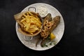Deep Fried goby fish with fried potatoes Royalty Free Stock Photo