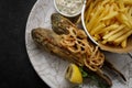 Deep Fried goby fish with fried potatoes Royalty Free Stock Photo