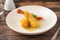 Deep fried kataifi wrapped shrimp served with lemon sauce Royalty Free Stock Photo