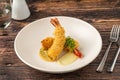 Deep fried kataifi wrapped shrimp served with lemon sauce Royalty Free Stock Photo