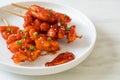 Deep fried Korean rice cake Tteokbokki skewered with spicy sauce Royalty Free Stock Photo