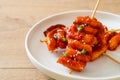 Deep fried Korean rice cake Tteokbokki skewered with spicy sauce Royalty Free Stock Photo