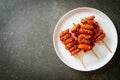 Deep fried Korean rice cake Tteokbokki skewered with spicy sauce Royalty Free Stock Photo