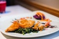 Deep fried mackerel steak with mashed purple sweet potatoes serve on white plate - organic food concept. Royalty Free Stock Photo