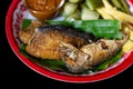 Deep fried mackerel in a vegetable dish Royalty Free Stock Photo