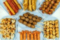 Deep fried meatballs on skewers made from variety of meats and sausages, mixed with flour and seasonings with lettuce as sides. Royalty Free Stock Photo