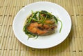 Deep fried Nile Tilapia or mango fish slice dressing soy sauce and spring onion on plate Royalty Free Stock Photo