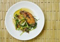 Deep fried Nile Tilapia or mango fish slice dressing soy sauce and spring onion on plate Royalty Free Stock Photo