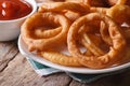 Deep fried onion rings and ketchup horizontal Royalty Free Stock Photo