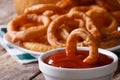 Deep-fried onion rings with ketchup macro. horizontal Royalty Free Stock Photo