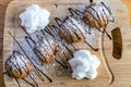 Deep fried oreo cookies on wooden tray