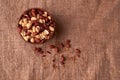 Deep fried peanuts in clay bowl over rustic wicker background. Selective focus Royalty Free Stock Photo