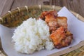 Deep fried pork with sticky rice on wood basket, thai food, thai