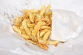 Deep fried potato chips from an English fish and chips shop Royalty Free Stock Photo