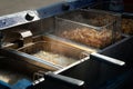 Deep-fried potatoes. French fries fried in boiling oil in a fryer Royalty Free Stock Photo