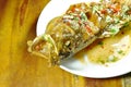 Deep fried red banded grouper fish dressing sweet chili sauce on plate Royalty Free Stock Photo