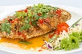 Deep fried red tilapia topped with sweet and sour sauce on top. Royalty Free Stock Photo