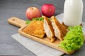 Deep fried sandwich stuffed tuna in wooden dish on table