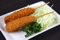 Deep fried sausage skewers with vegetables