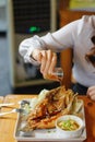 Deep fried sea bass with fish sauce and spicy seafood sauce is a popular dish for seafood restaurants that often have a menu of Royalty Free Stock Photo