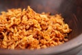 Deep fried shallots in wooden bowl. Roasted onion