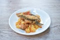 Deep fried slice mango fish with pineapple and chili in sweet sour sauce on plate Royalty Free Stock Photo