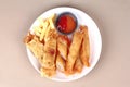 Deep fried spring roll,and frence fries sreved with tomato souce and chili sauce.