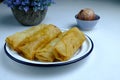 Deep fried spring rolls, popia Malaysia, asian traditional dessert  on white plate Royalty Free Stock Photo