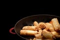 Deep fried spring rolls  surve on the pan in dark background Royalty Free Stock Photo