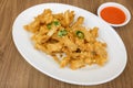 Deep fried squid calamari with spicy sriracha sauce Royalty Free Stock Photo