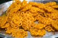 Deep fried sweets on sale in a homemade food market sal in the streets of Varanasi, India