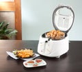 Deep fryer machine with chicken Royalty Free Stock Photo