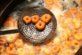 Deep frying medu vada in the pan. Medu Vada is a savoury snack from South India, very common street food Royalty Free Stock Photo