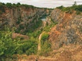 Deep grand canyon with blue lake at bottom.  Many roads Royalty Free Stock Photo