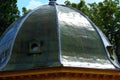 Deep green copper plated dome roof in summer rain