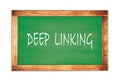 DEEP LINKING text written on green school board