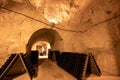 Deep and long undergrounds caves for making champagne sparkling wine from chardonnay and pinor noir grapes in Reims, Champagne,