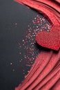 A deep matte black backdrop features a stunning red glitter border, creating a dramatic and passionate atmosphere. Soft Royalty Free Stock Photo