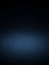 A deep navy blue gradient background with a subtle spotlight effect in the center, creating a dark and atmospheric mood for Royalty Free Stock Photo