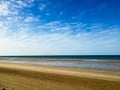 Deep Oman beach sky overcasted with clouds, blue sky with fainte Royalty Free Stock Photo