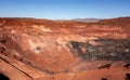 Deep pit of red iron ore mine in Pilbara region in Western Australia Royalty Free Stock Photo