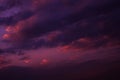 Deep purple magenta violet navy blue sky. Dramatic evening sky with clouds. Colorful sunset background. Royalty Free Stock Photo