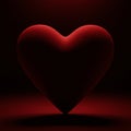 A deep red, heart-shaped object is prominently displayed against a dark background. Royalty Free Stock Photo