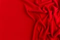 Deep red silk smooth wavy background with copy space. Royalty Free Stock Photo