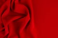 Deep red silk smooth wavy background with copy space