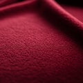 Deep red textured fabric with a soft, plush appearance. The material displays a gentle Royalty Free Stock Photo