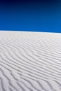 Deep Ripples In Undisturbed Sand Dune With Dark Blue Sky Above