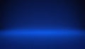 Deep Royal Blue Studio Background with Subtle Gradient Lighting and Horizon Effect Royalty Free Stock Photo