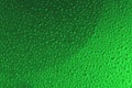 Deep saturated green gradient color background with water drop pattern, blurred background