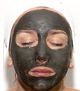 Deep sea mud mask treatment Royalty Free Stock Photo